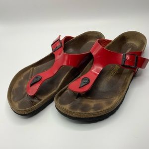 Red Birkenstock sandals. W42.
